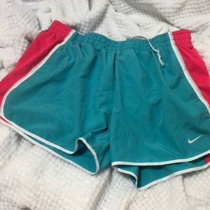 Teal and bright pink Nike shorts